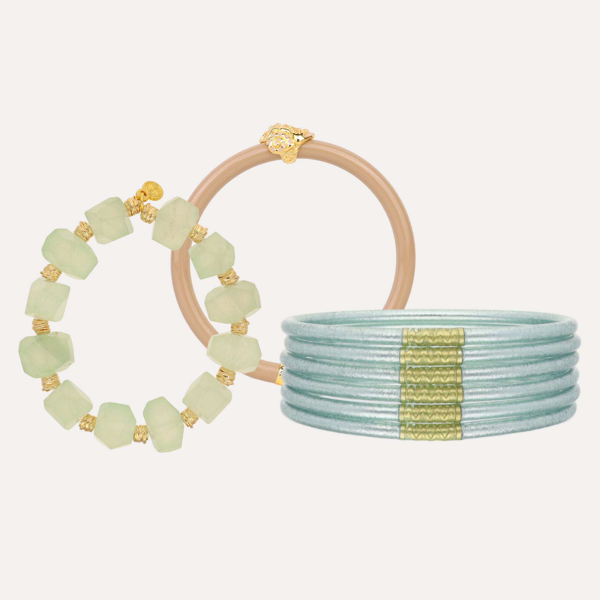 a group of bracelets with a gold band