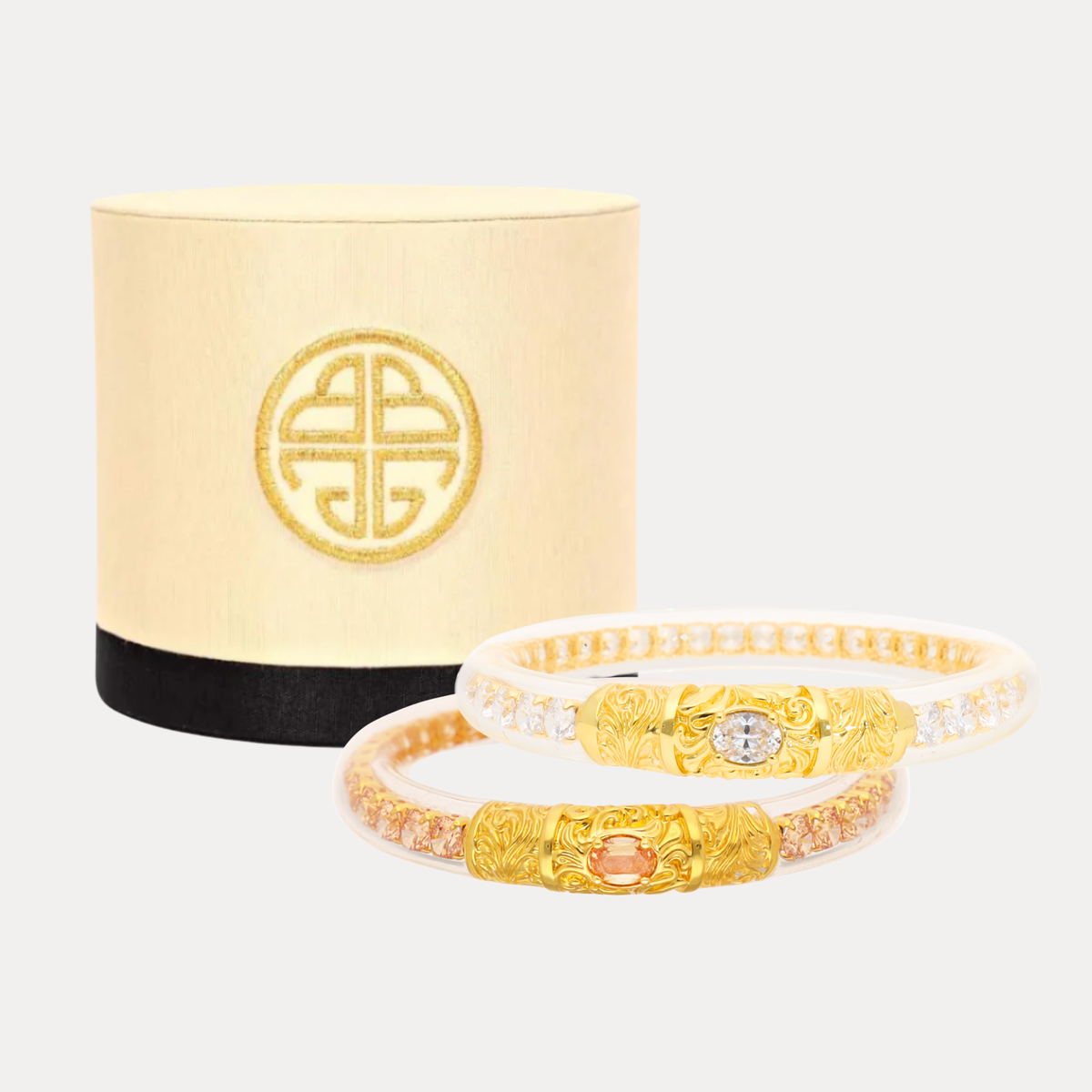 BuDhaGirl Champagne and crystal bangles with ornate gold center details displayed beside a cream and black presentation box for women who love refined jewelry