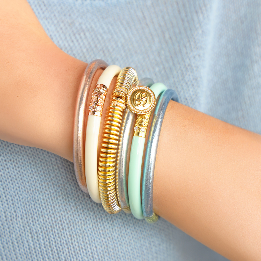 a person wearing bracelets on their wrist