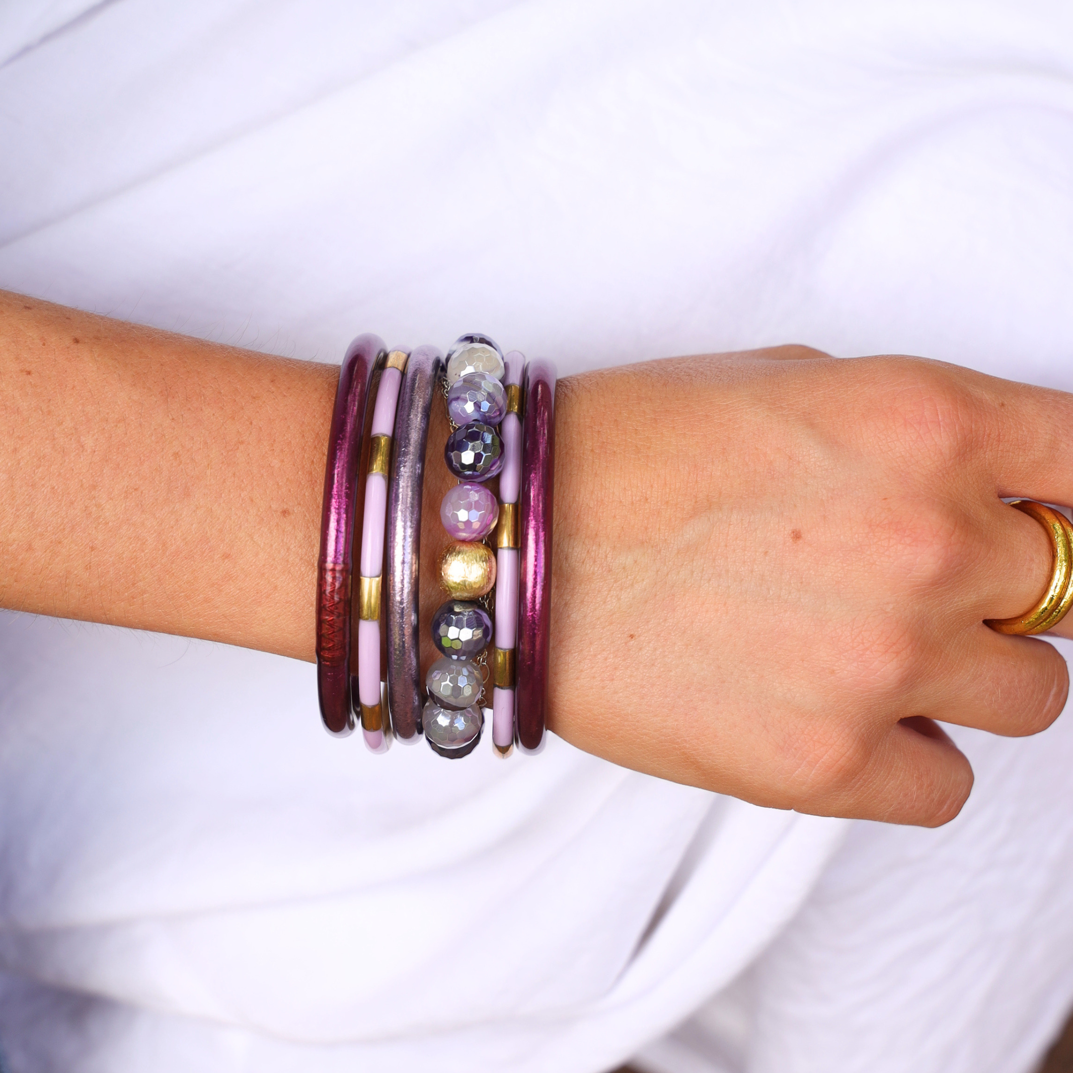 a hand with bracelets on it