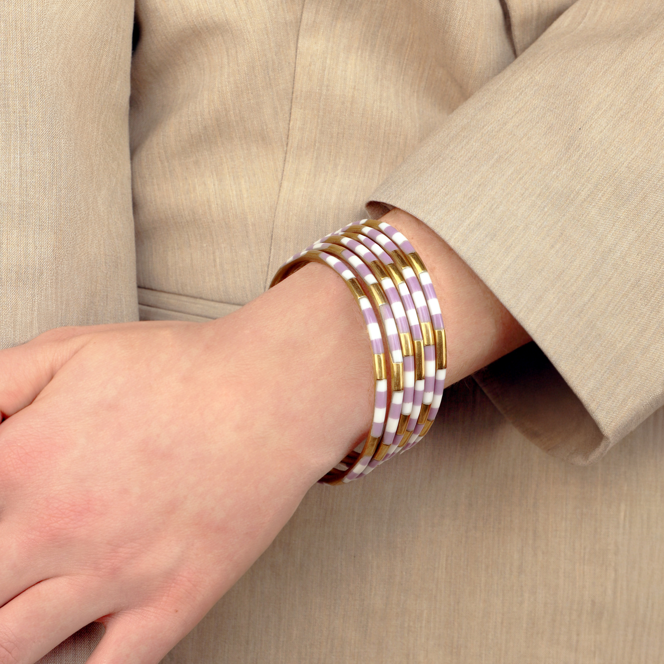 a person wearing bracelets on their wrist