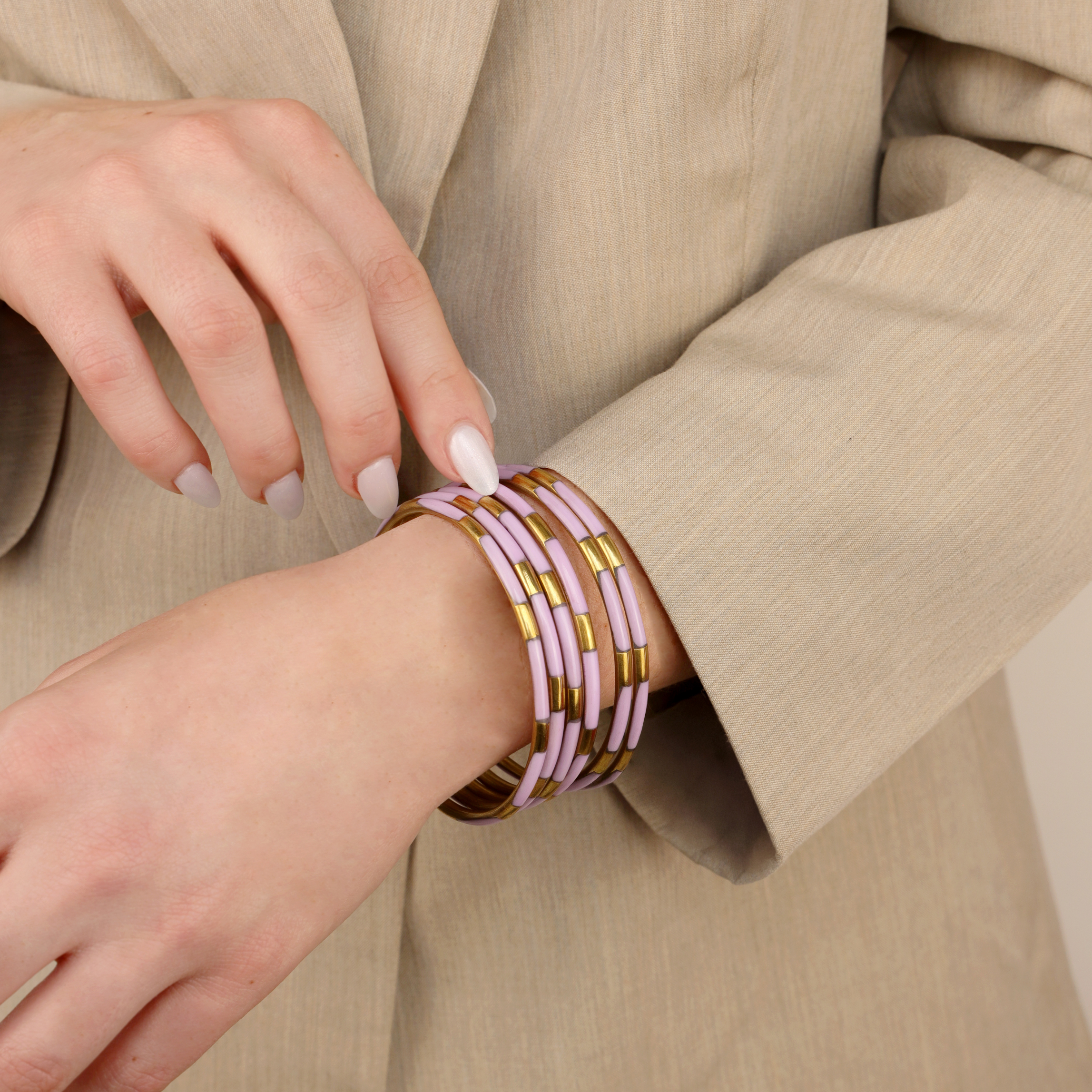 a woman wearing a beige coat