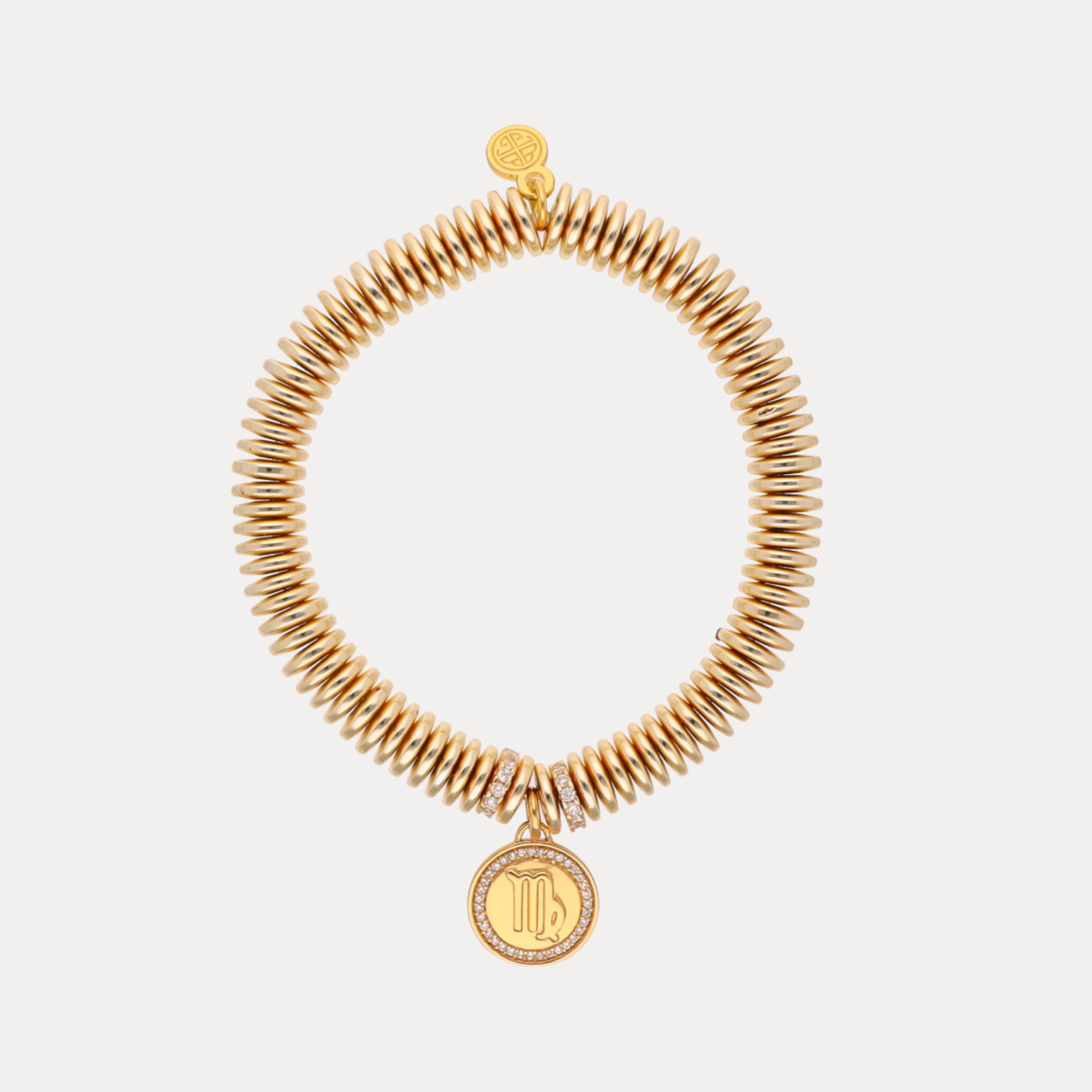 a gold bracelet with a pendant