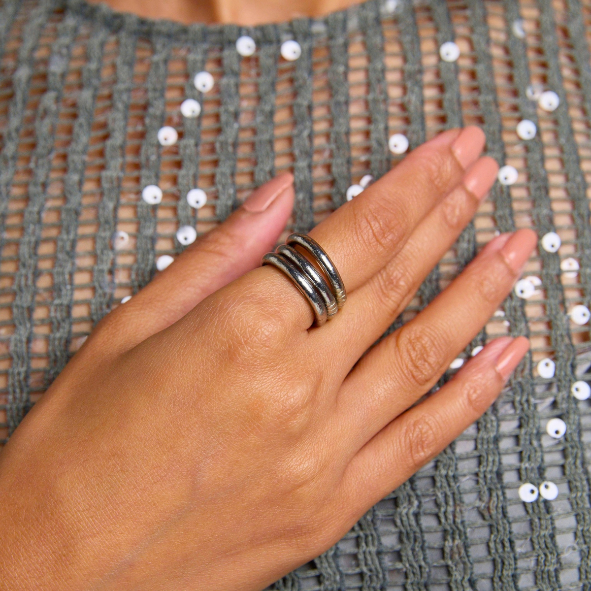 a hand with a ring on it