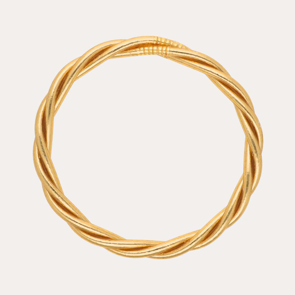a gold ring with a knot