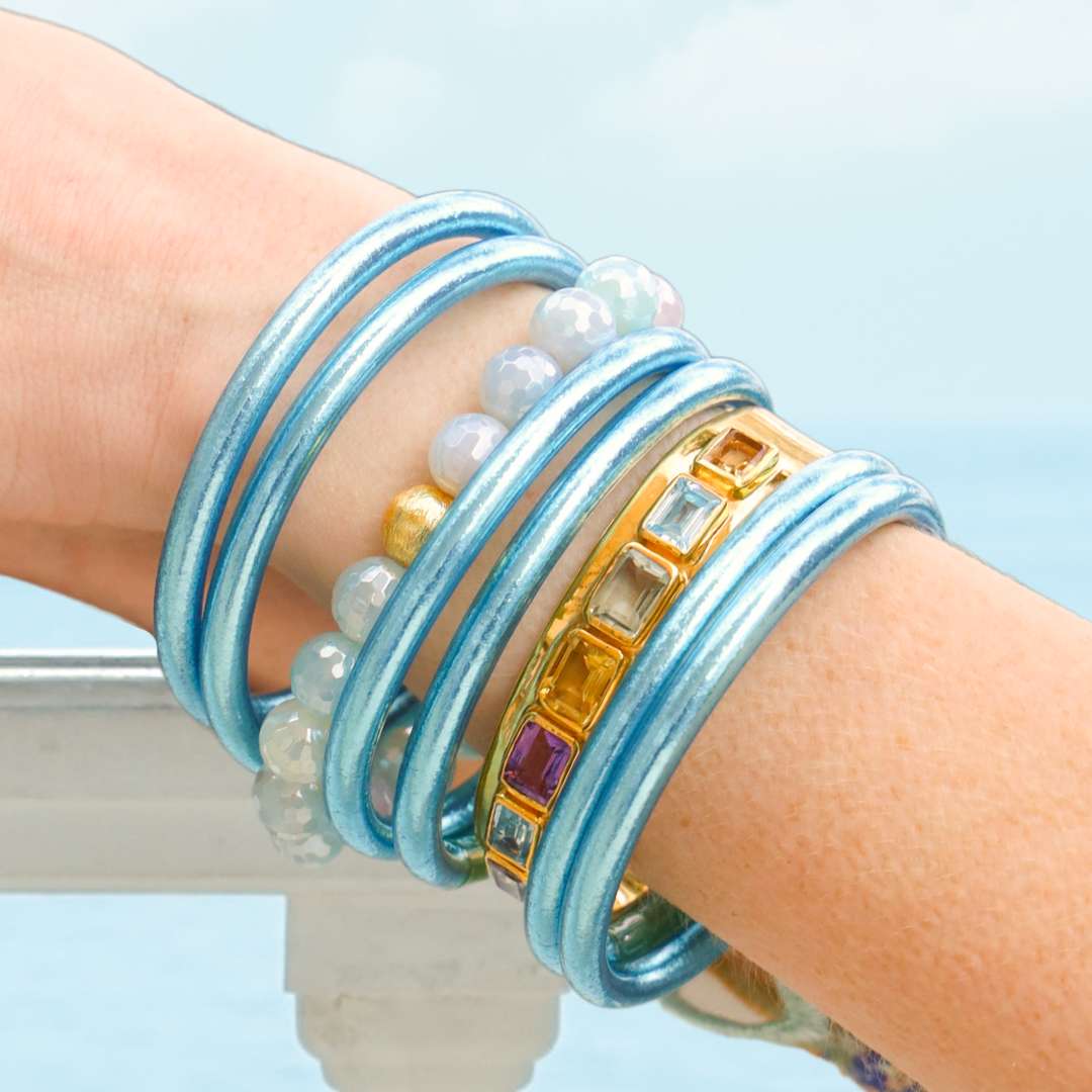 Azure Blue Bracelet Stack on Model with Arms Resting on White Balcony Fence | BuDhaGirl