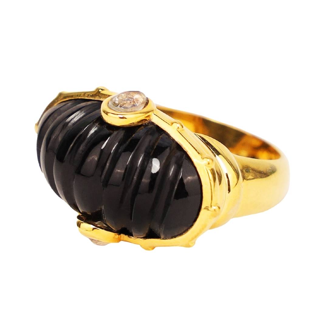 BuDhaGirl gold ring with a black dome resin stone and a crystal on a white background