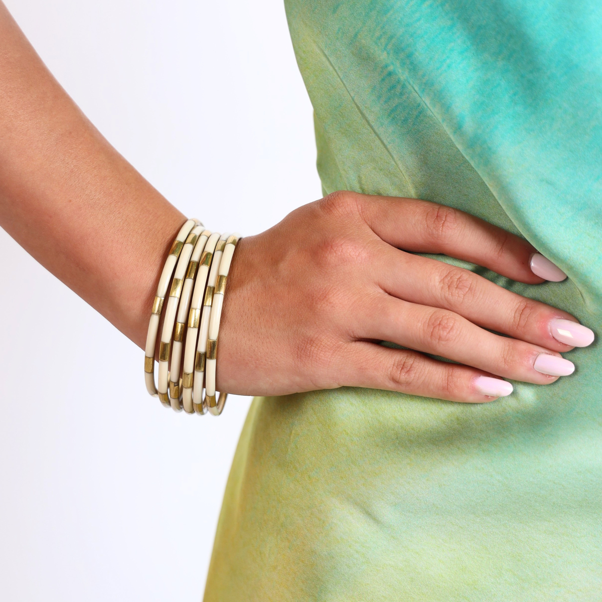 a hand with bracelets on a woman's hand