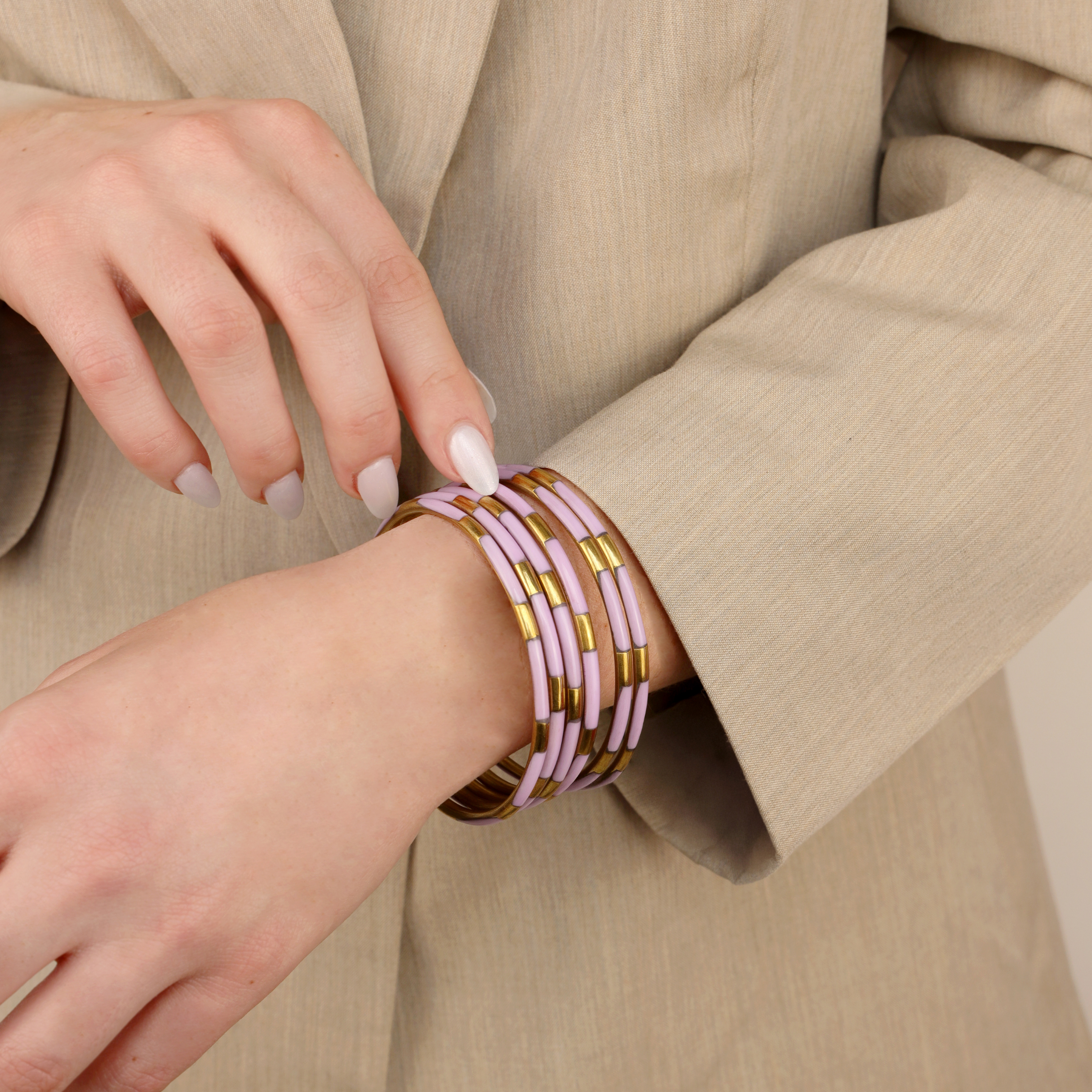 a woman wearing a beige coat
