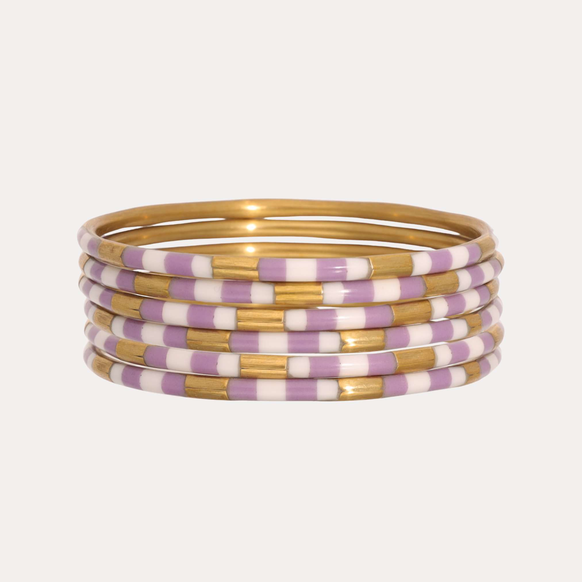 a stack of purple and gold bracelets