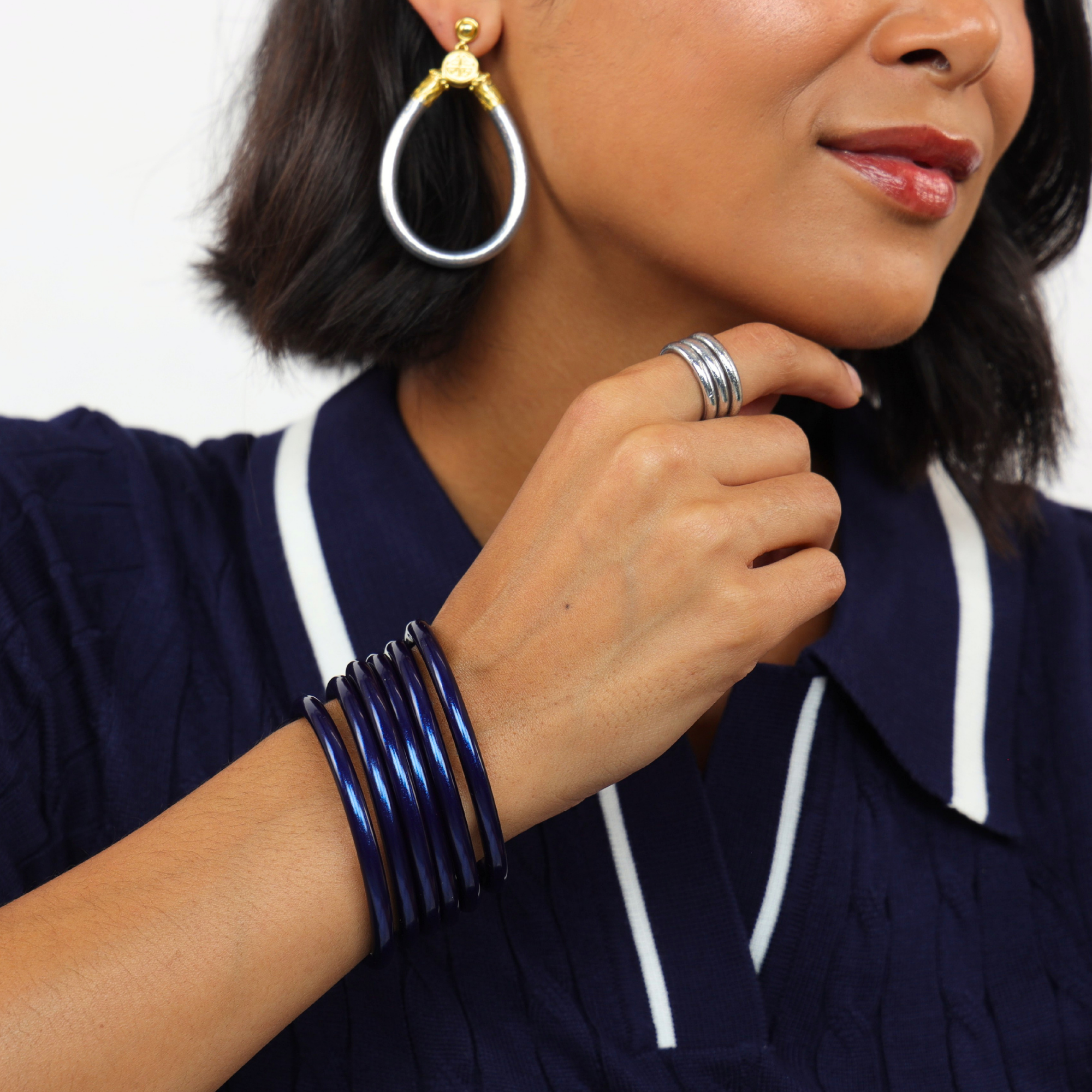 Midnight All Weather Bangles® (Set of 3) - Serenity Prayer worn with silver hoop earrings and a stylish outfit.