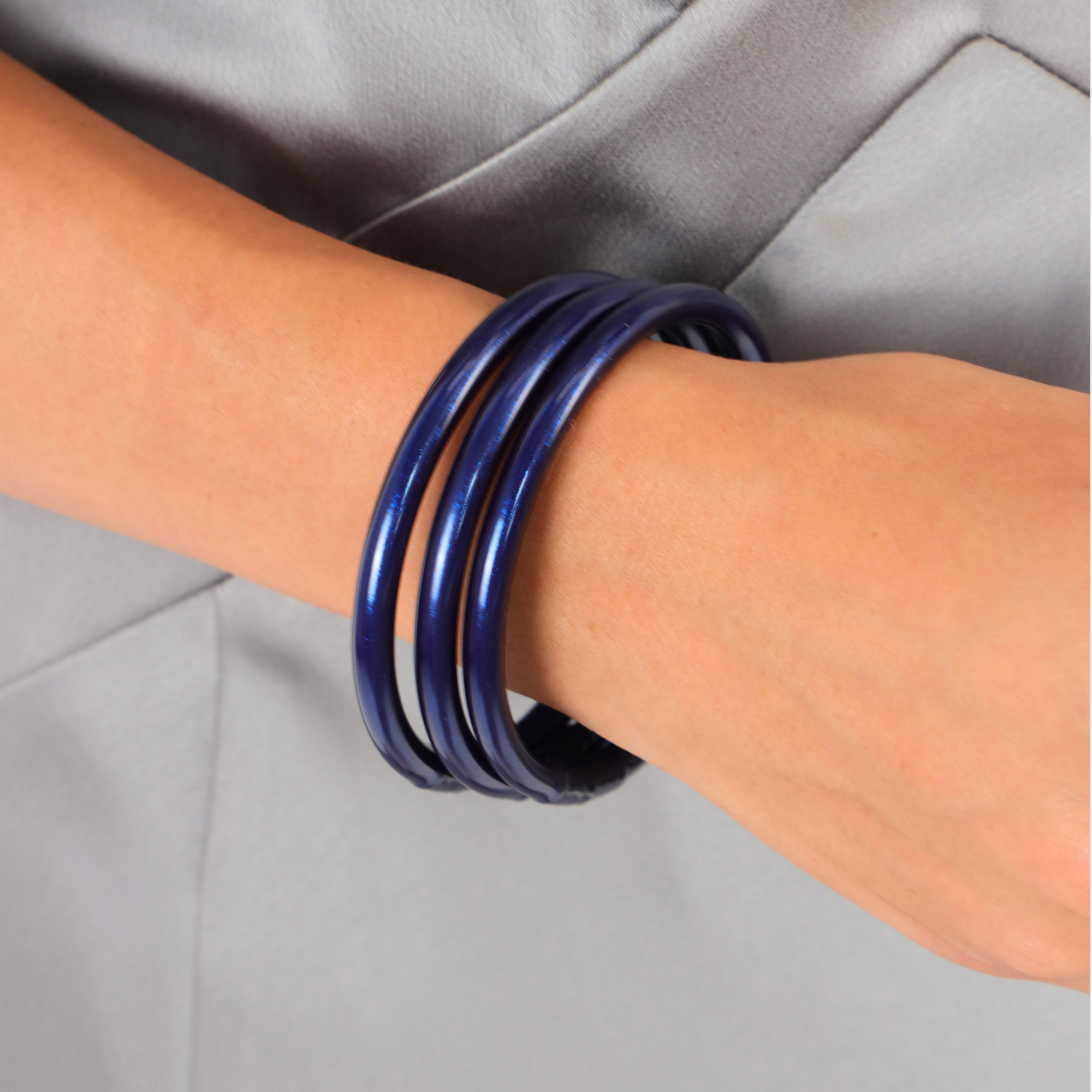 Midnight All Weather Bangles® (Set of 3) - Serenity Prayer worn on a wrist, showcasing deep navy hue and shine.