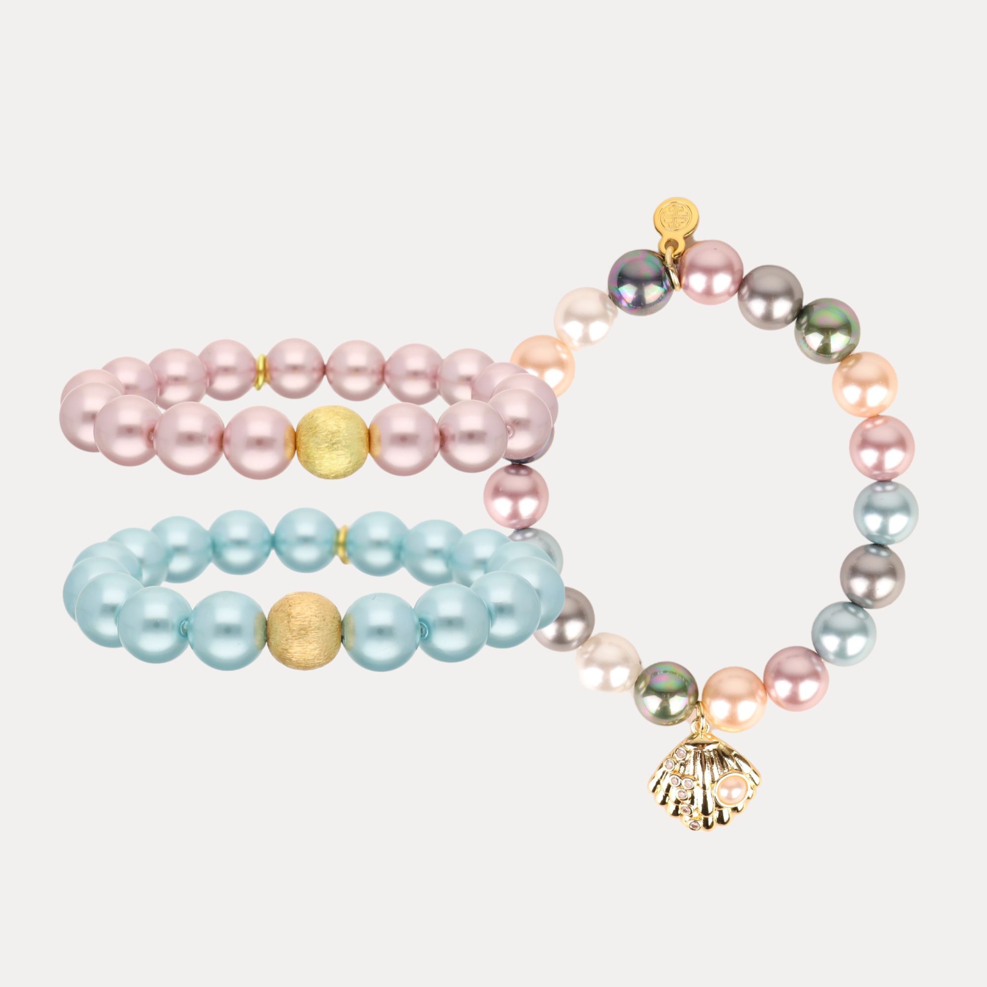 a group of bracelets with pearls