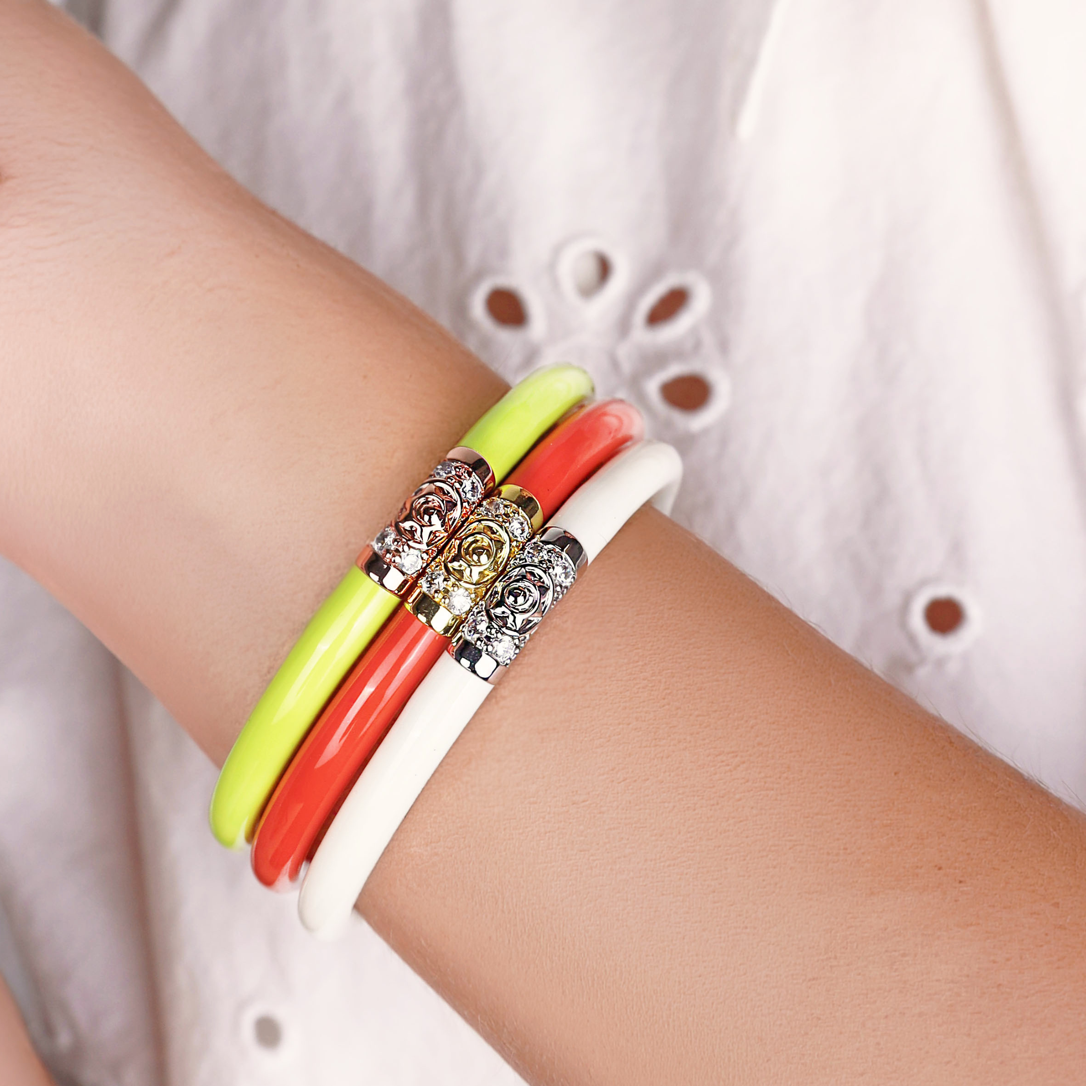 a person wearing bracelets on their wrist
