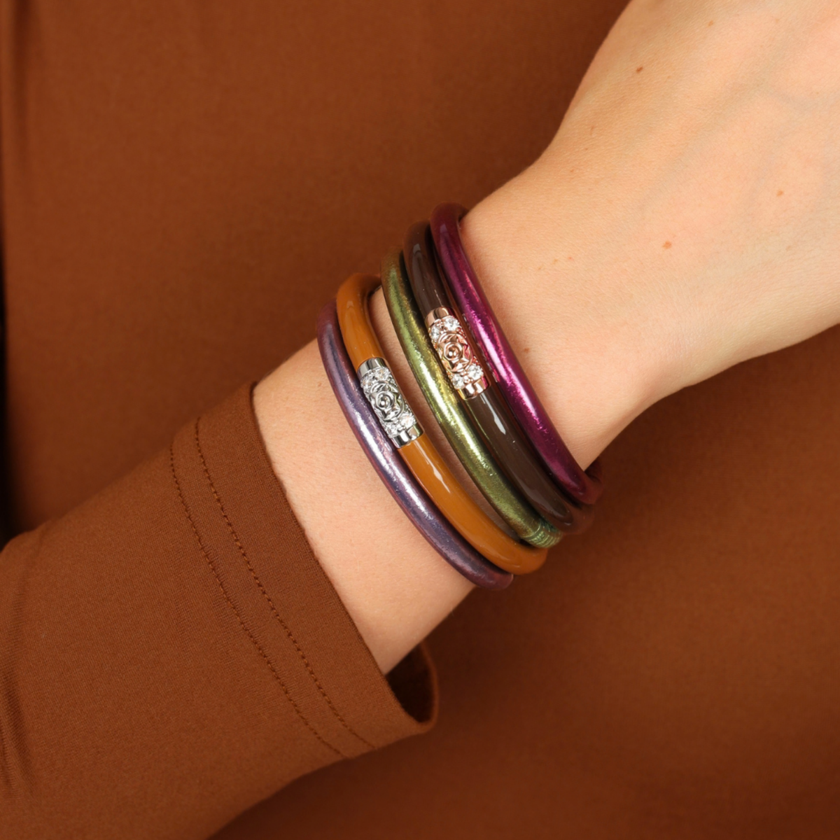 a person wearing bracelets on their wrist