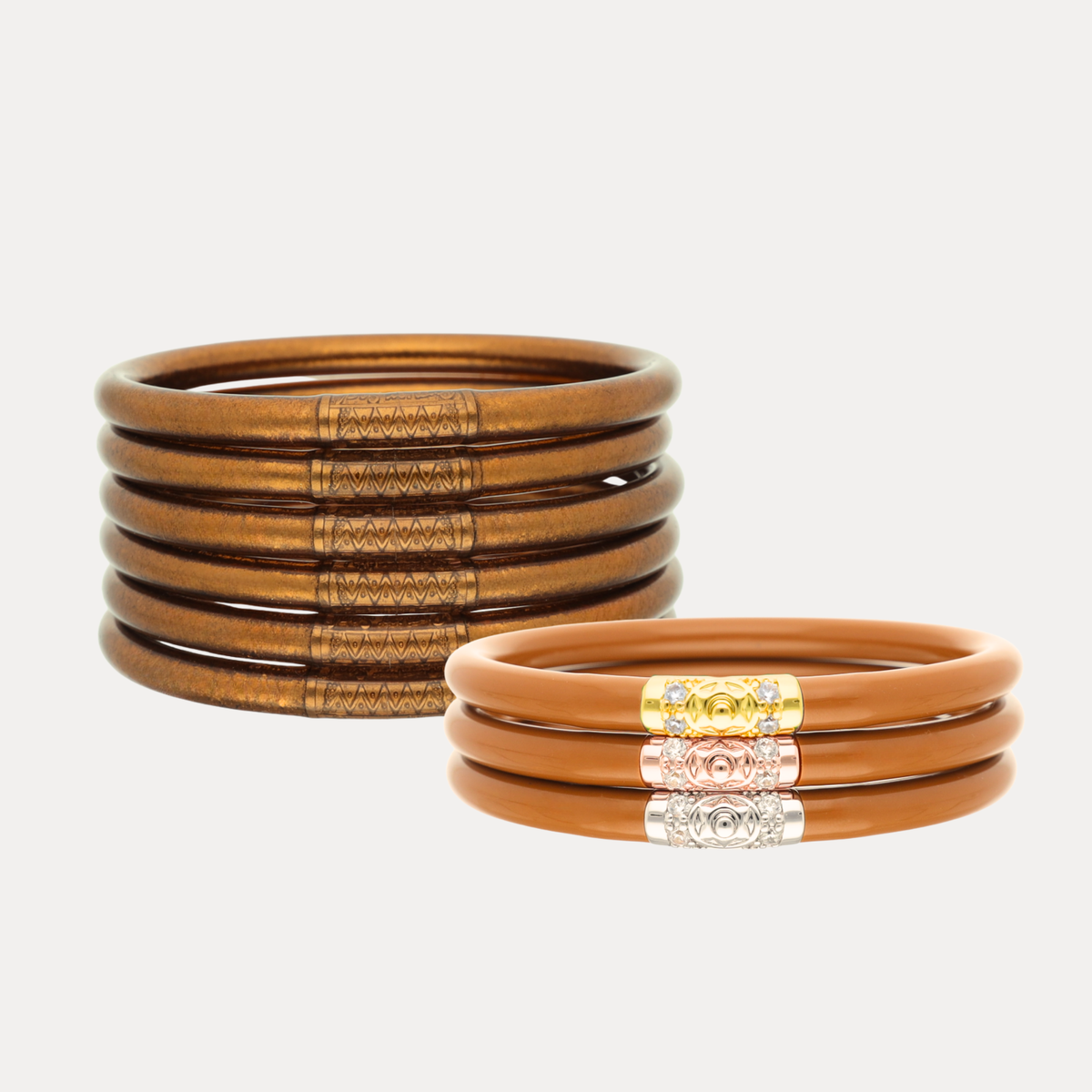 a stack of brown and gold bracelets