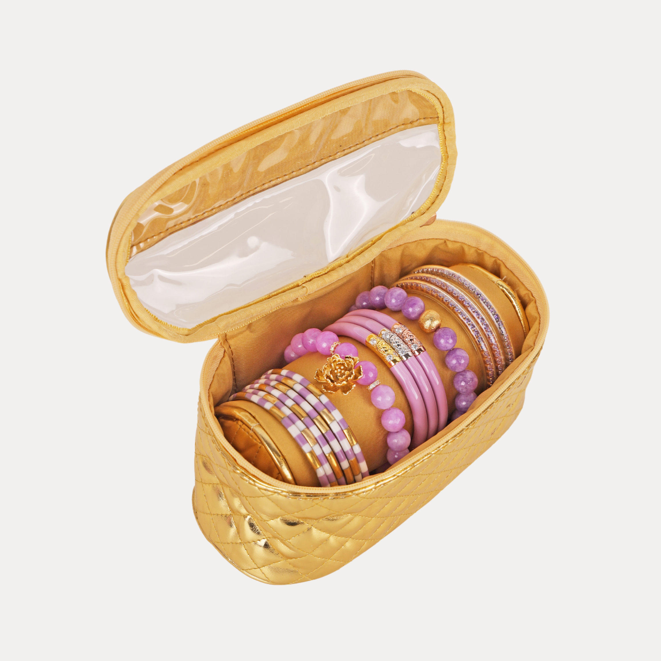 a gold jewelry case with bracelets