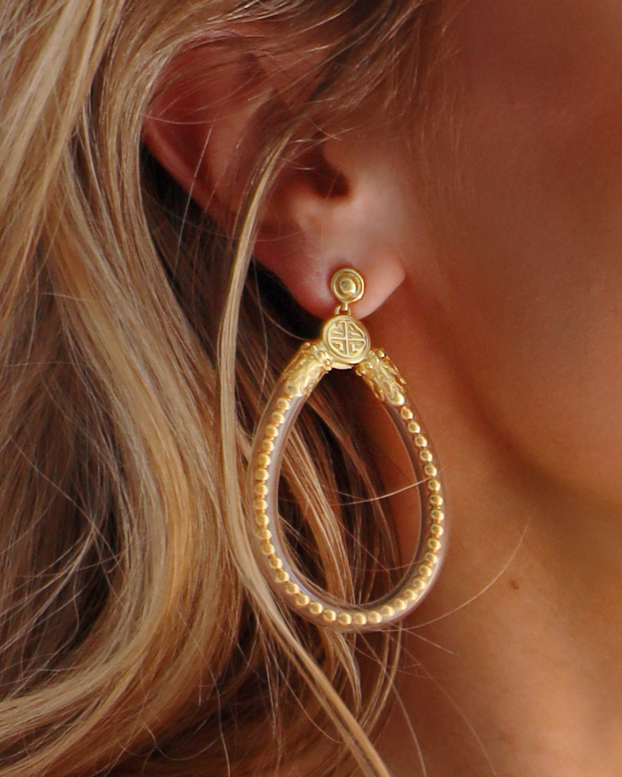 a close up of a woman's ear