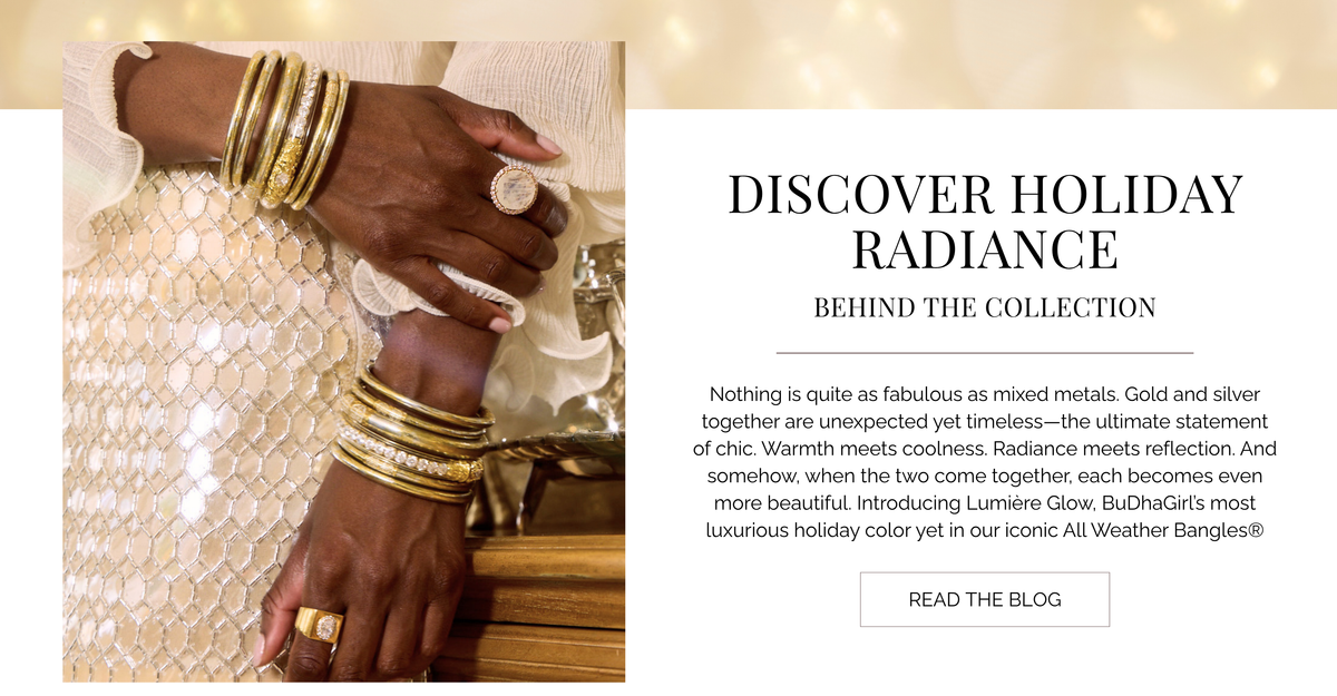 Website banner showing hands adorned with stacked gold and silver bangle bracelets and rings beside a Discover Holiday Radiance blog panel with a Read the Blog button