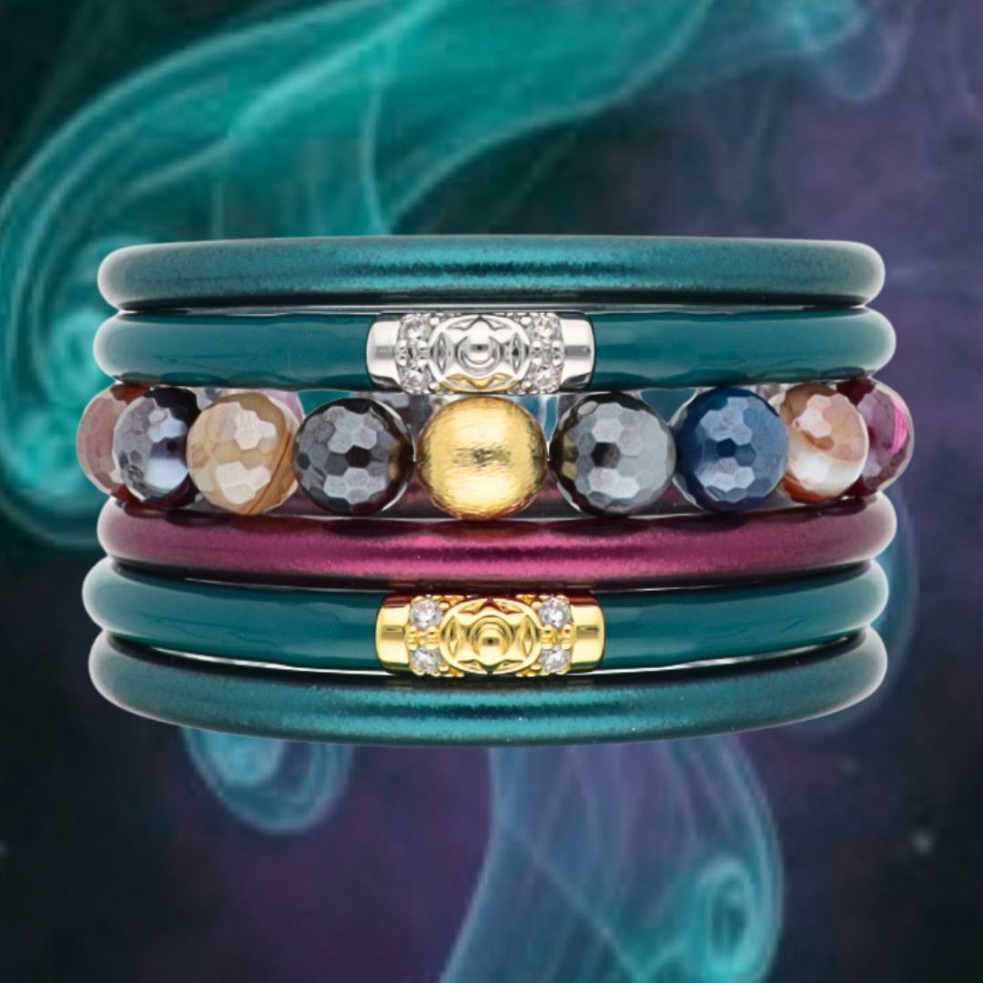 a stack of colorful bracelets